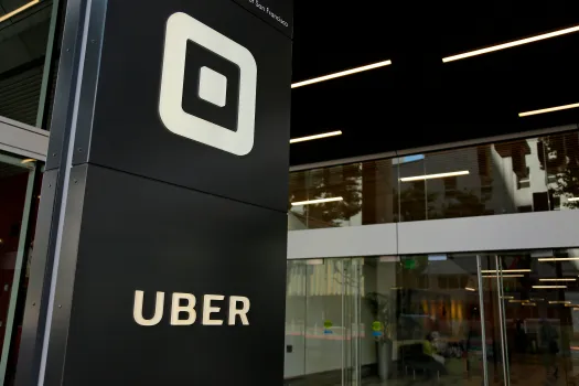 Uber Technologies Inc: Navigating Market Momentum Amidst Diverging Analyst Opinions